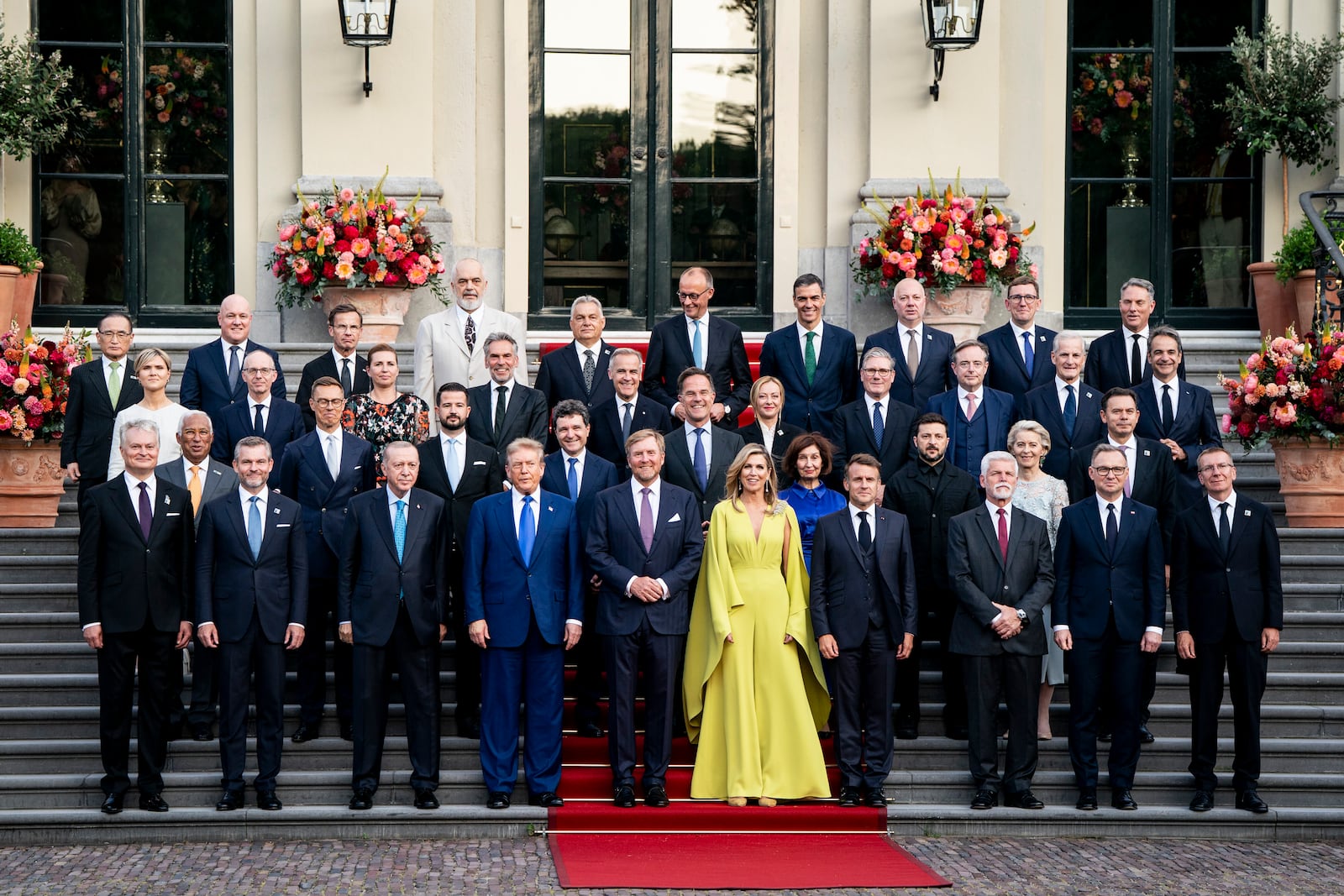 Participants pose for a family photo at the 2025 NATO summit in The Hague, on Tuesday, June 24, 2025. (Haiyun Jiang/Pool Photo via AP)