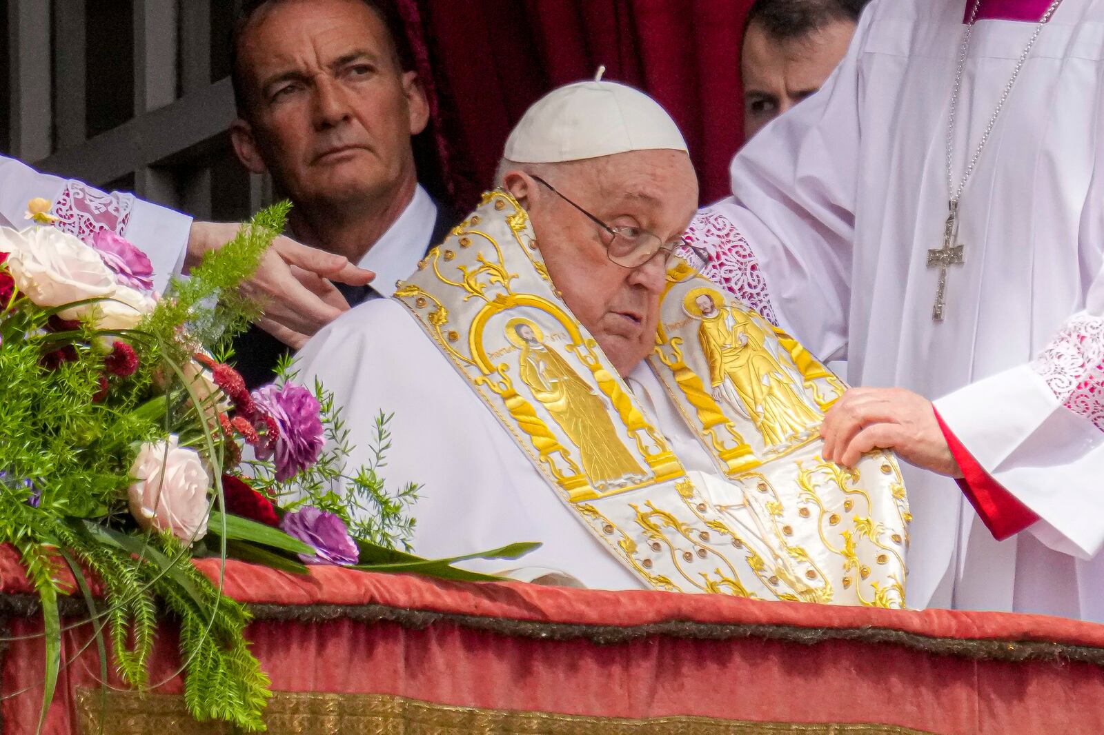 Pope Francis appears on the central lodge of St. Peter's Basilica to bestow the Urbi et Orbi (Latin for to the city and to the world) blessing at the end of the Easter mass presided over by Cardinal Angelo Comastri in St. Peter's Square at the Vatican Sunday, April 20, 2025.(AP Photo/Gregorio Borgia)