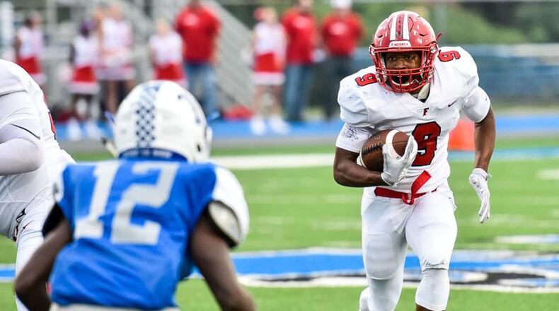Fairfield’s JuTahn McClain (9) runs toward Hamilton’s James Turner during a 40-6 FHS victory Sept. 7 at Virgil Schwarm Stadium in Hamilton. NICK GRAHAM/STAFF