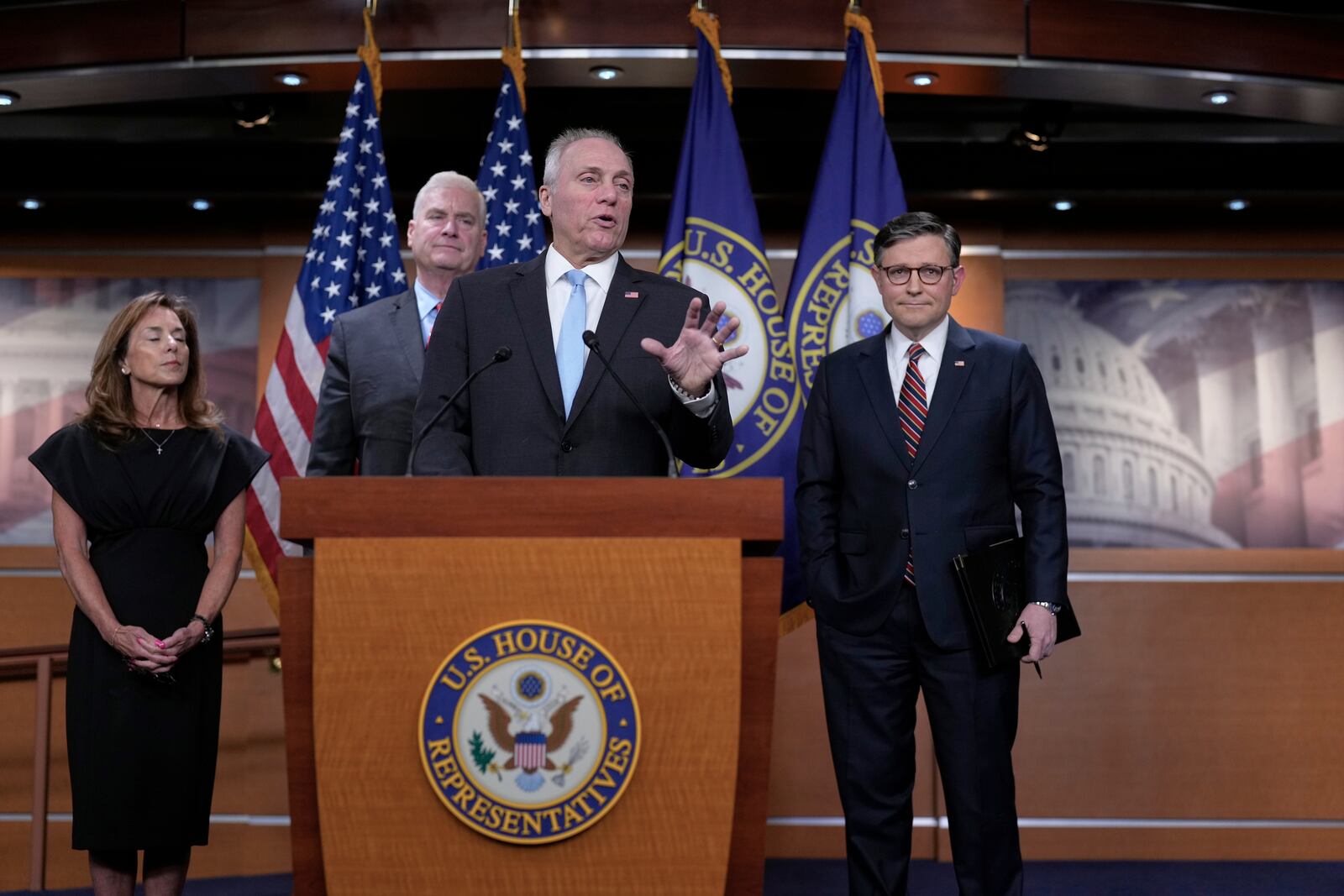 House Republican leaders, from left, Rep. Lisa McClain, R-Mich., Majority Whip Tom Emmer, R-Minn., Majority Leader Steve Scalise, R-La., and Speaker of the House Mike Johnson, R-La., talk to reporters about the push for a House-Senate compromise budget resolution to advance President Donald Trump's agenda, even with opposition from hard-line conservative Republicans, at the Capitol in Washington, Tuesday, April 8, 2025. (AP Photo/J. Scott Applewhite)