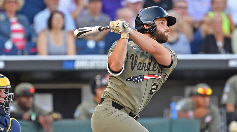 Vanderbilt's Ty Duvall singles in a run in the second inning against the Michigan Wolverines during game one of the College World Series Championship Series on June 24, 2019 at TD Ameritrade Park Omaha in Omaha, Nebraska.  (Photo by Peter Aiken/Getty Images)