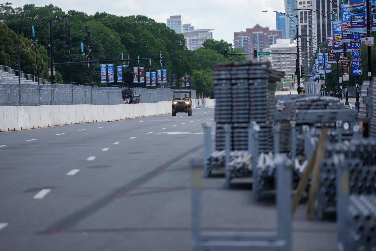 Construction of the street course continues ahead of the NASCAR auto racs, Friday, June 27, 2025, in downtown Chicago. (AP Photo/Erin Hooley)