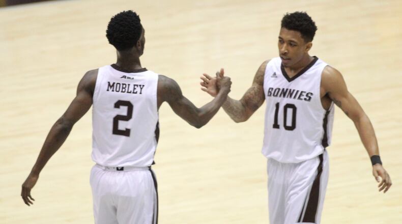 St. Bonaventure’s Matt Mobley and Jaylen Adams slap hands after a basket in the first half on Tuesday, Jan. 3, 2017, at the Reilly Center in Olean, N.Y. David Jablonski/Staff