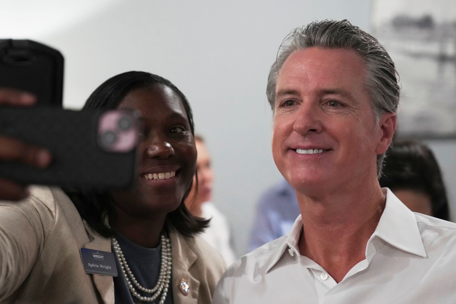 Gov. Gavin Newsom, D-Calif., greets people in a coffee shop during a two-day swing through South Carolina on Tuesday, July 8, 2025, in Florence, S.C. (AP Photo/Meg Kinnard)