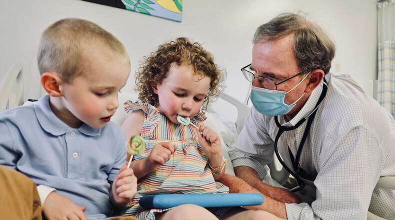 Dr. Robert Frenck chats with William, 3, and his sister, Lillian, 4, after they received doses of the Pfizer vaccine as part of a clinical trial at Cincinnati Children’s. Submitted photo.