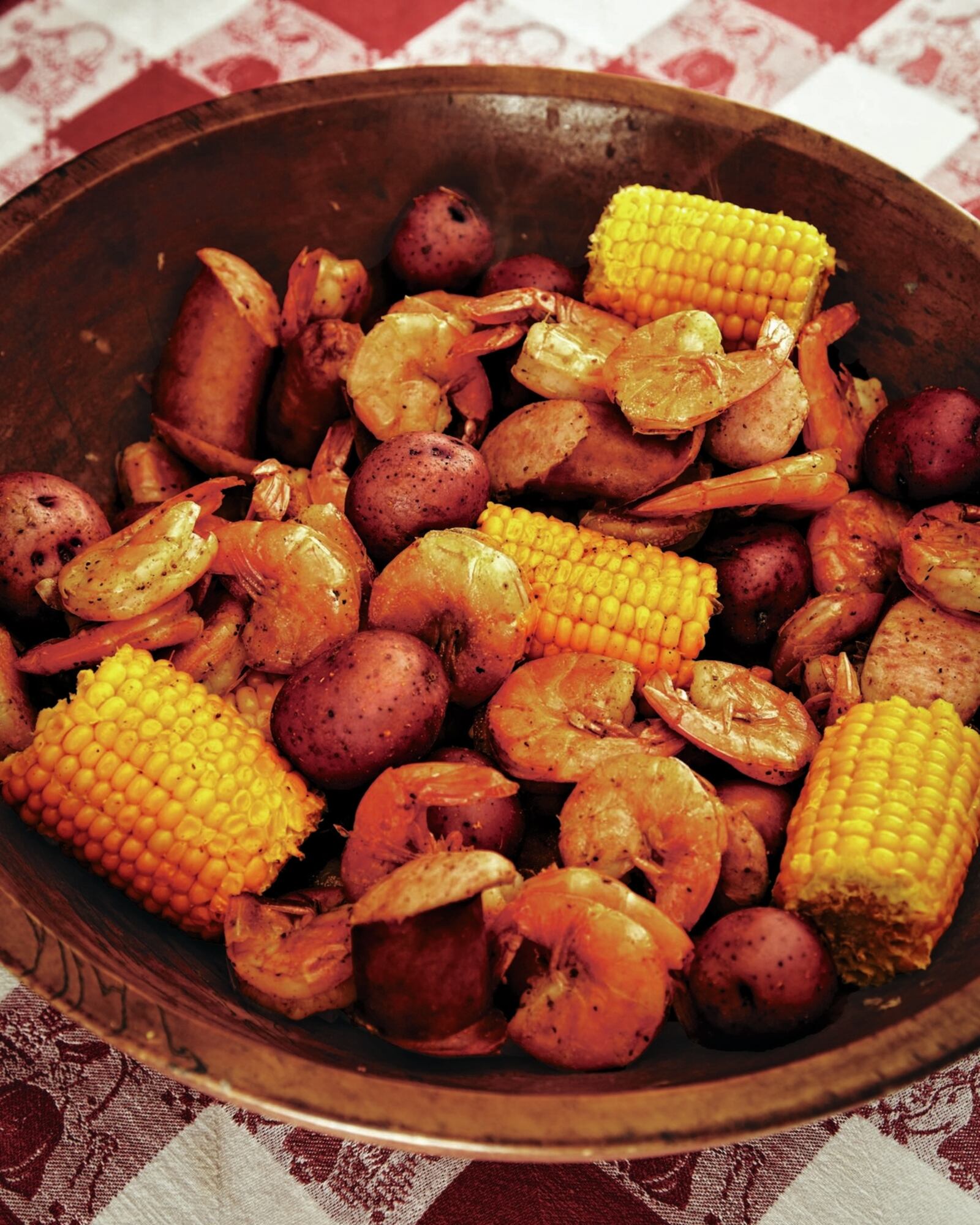 Slow cookers are great for making all kinds of party-friendly dishes, including a Cajun shrimp boil, from “The Great American Slow Cooker Book,” by Bruce Weinstein and Mark Scarbrough.