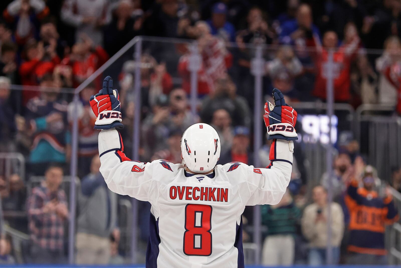 Washington Capitals left wing Alex Ovechkin (8) celebrates after scoring his 895th career goal during the second period of an NHL hockey game against New York Islanders in Elmont, N.Y., Sunday, April 6, 2025. (AP Photo/Adam Hunger)