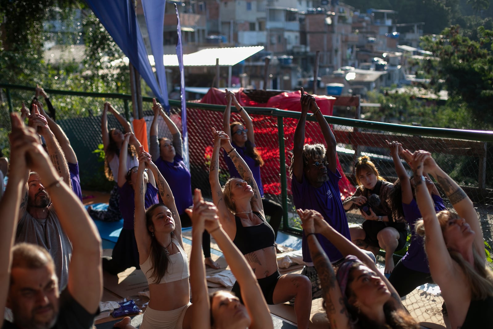 People attend a Transformation Project yoga class in the Rocinha favela, in Rio de Janeiro, Wednesday, July 9, 2025. (AP Photo/Bruna Prado)