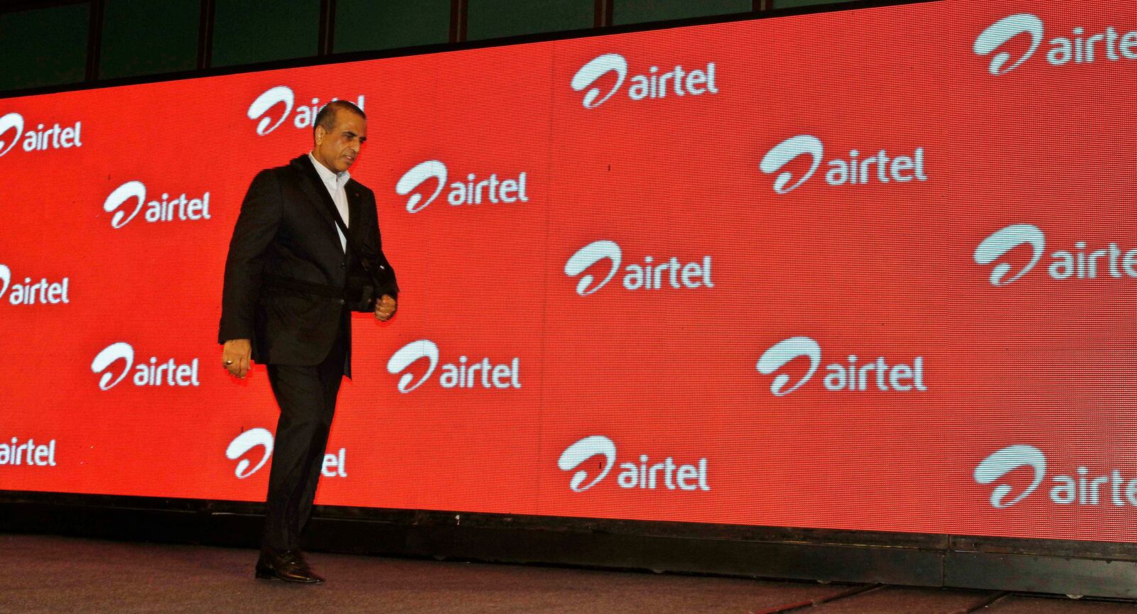 FILE- In this Tuesday, April 10, 2012, file photo, Bharti Airtel Ltd. Chairman and Managing Director Sunil Mittal walks as he attends a press conference during launch of Airtel's 4G services, in Kolkata, India. (AP Photo/Bikas Das, File)