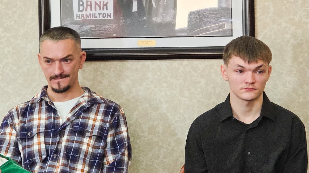 Fred Anthony Carr II, left, and his son, Caleb Anthony Carr, appeared in a Butler County courtroom Tuesday, Dec. 16, 2025. They are charged with reckless homicide in connection with the May 10, 2025 stabbing death of Jacob Spencer. Bond was set at $200,000 each. NICK GRAHAM/STAFF