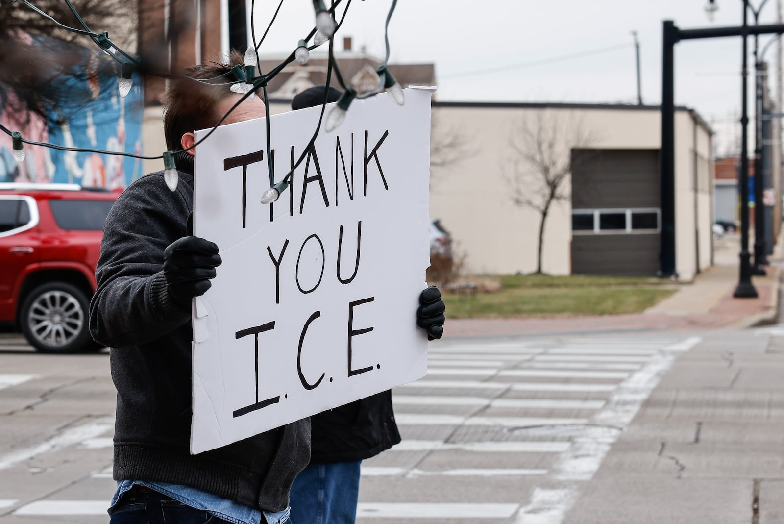 A group with Butler County for Immigrant Justice attended the Butler County Commission meeting to express their concerns over U.S. Immigration and Customs Enforcement detainees being housed in the Butler County jail and ask commissioners to end the contract. The group gathered at the corner of High Street and Martin Luther King Jr. Blvd. with signs after the meeting. A lone sign supporting ICE was seen amongst the others. NICK GRAHAM/STAFF