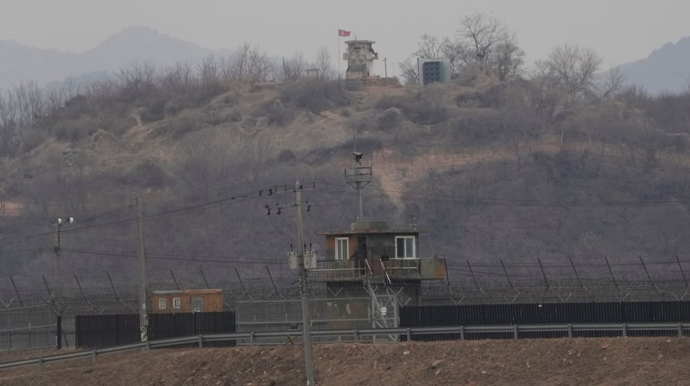 A North Korean military guard post, top, and a South Korean post, bottom, are seen from Paju, South Korea, near the border with North Korea, Thursday, Feb. 26, 2026. (AP Photo/Ahn Young-joon)