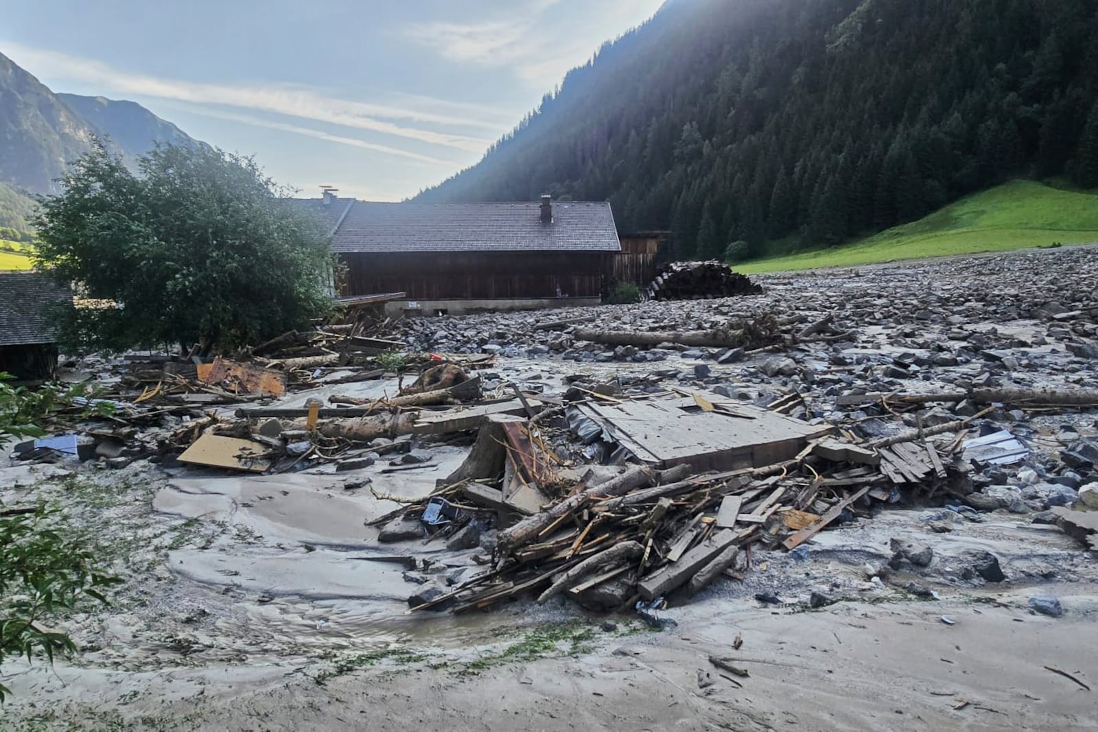 A mudslide covered homes and a street in the Gschnitztal valley in Tyrol, Austria, Tuesday, July 1, 2025. (BFV IBK-Land via AP)