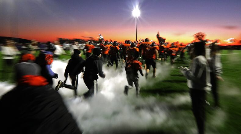 The West Liberty-Salem football team takes the field. BILL LACKEY/STAFF