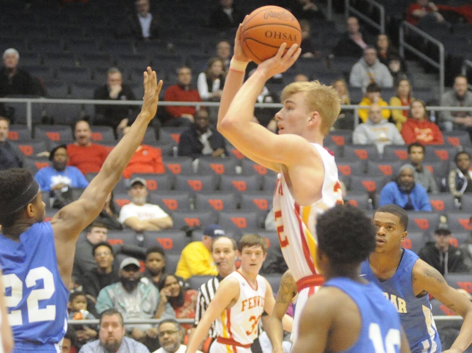 Fenwick’s C.J. Napier puts up a shot over Dunbar’s DaShaun Huffman (22) on Wednesday night during a Division II sectional final at the University of Dayton Arena. MARC PENDLETON/STAFF