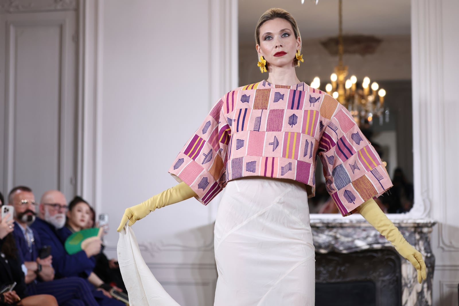 A model wears a creation as part of the Imane Ayissi Fall-Winter 2025/26 Haute Couture collection presented Monday, July 7, 2025, in Paris. (AP Photo/Tom Nicholson)