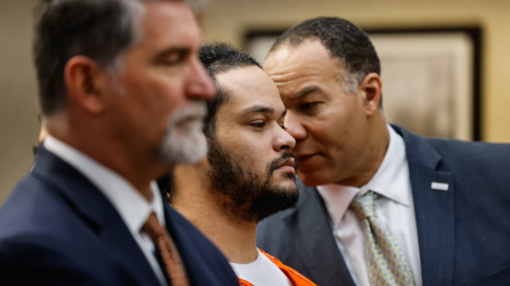 Natrone C. Kakaris faces one count of aggravated murder and two counts of murder on a three-count indictment out of Butler County Common Pleas Court. He appeared in court Thursday for an arraignment hearing with defense attorneys David Brewer (left) and Lawrence Hawkins (right). NICK GRAHAM/STAFF