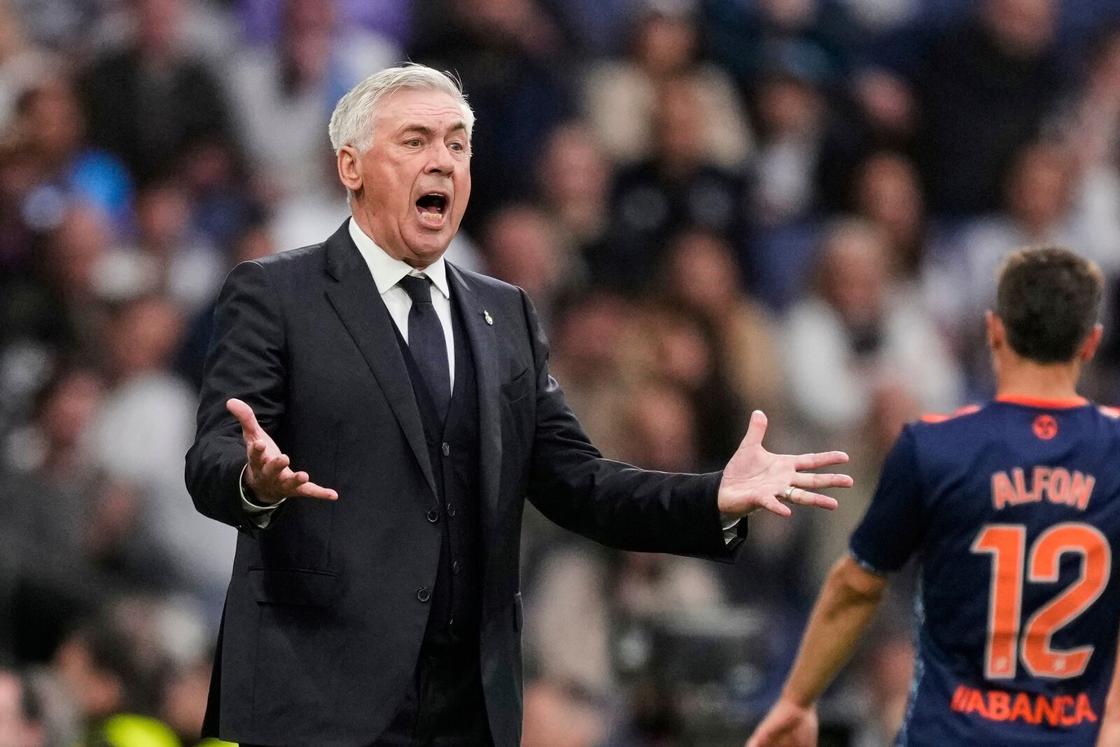 Real Madrid's head coach Carlo Ancelotti reacts during the Spanish La Liga soccer match between Real Madrid and Celta Vigo at the Santiago Bernabeu stadium in Madrid, Spain, Sunday, May 4, 2025. (AP Photo/Jose Breton)