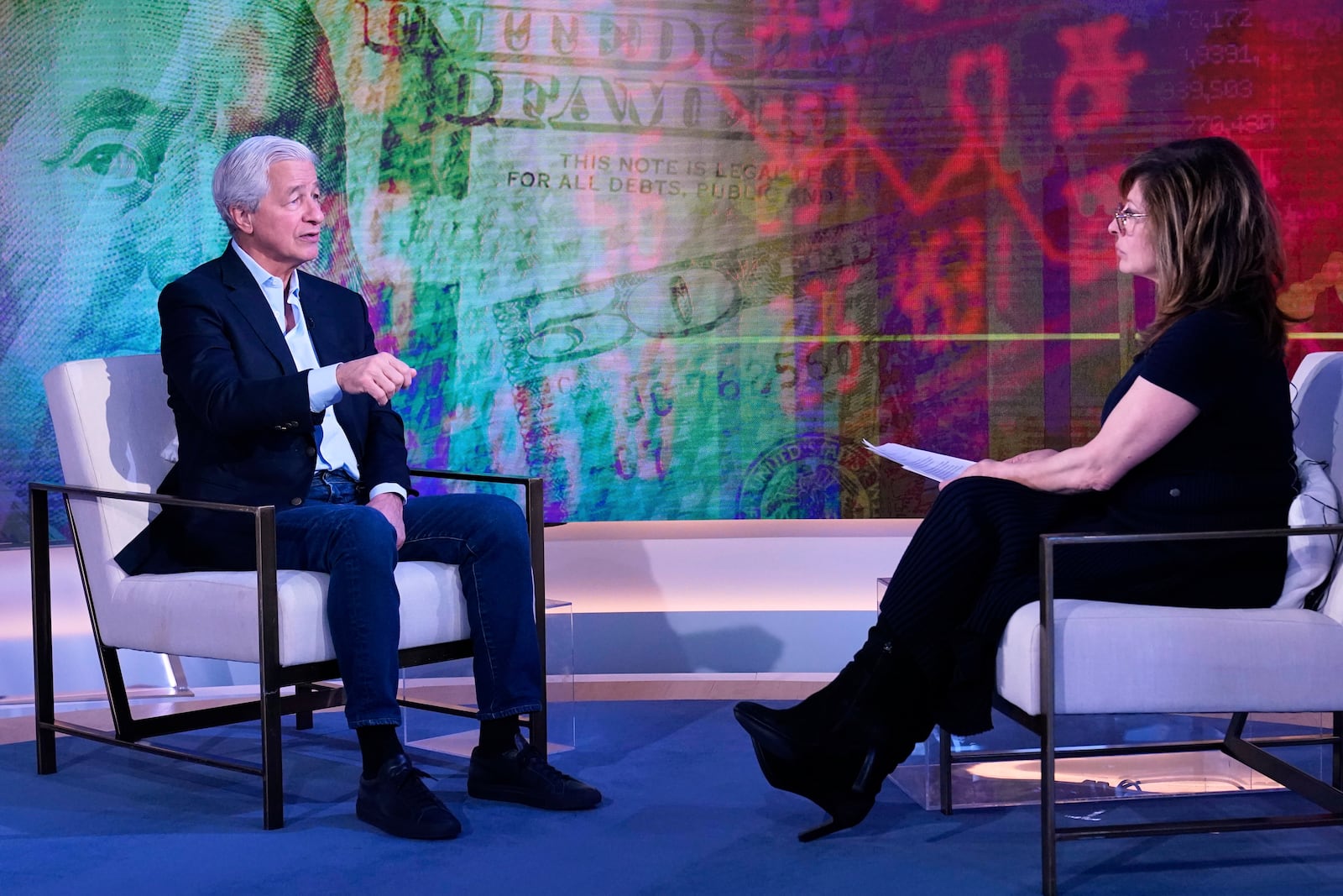 JPMorgan CEO Jamie Dimon, left, is interviewed by Maria Bartiromo on the "Mornings with Maria Bartiromo" program, on the Fox Business Network, in New York Wednesday, April 9, 2025. (AP Photo/Richard Drew)