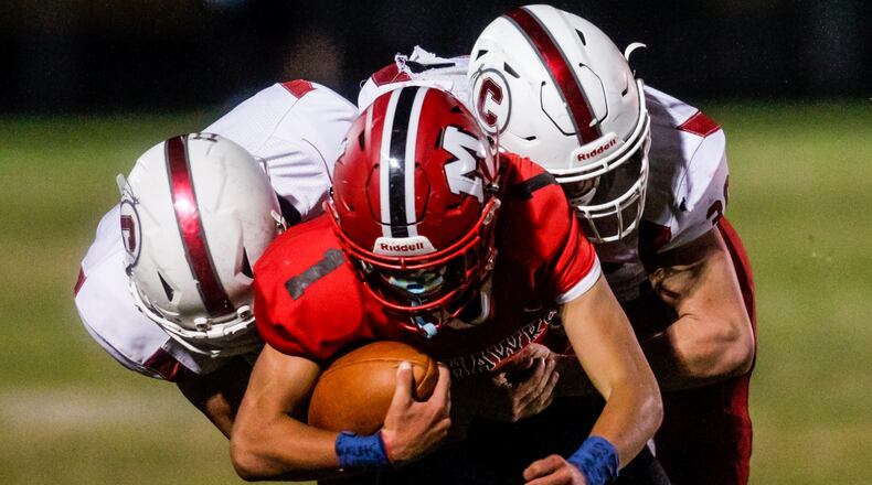 Madison running back Jake Valerio carries the ball during their football game against Carlisle Friday, Sept. 18, 2020 at Madison High School in Madison Township. Madison won 30-20. NICK GRAHAM / STAFF