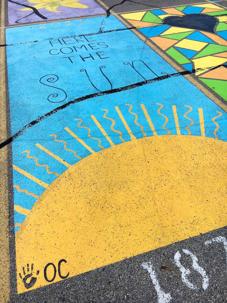 PHOTOS Lakota East seniors paint parking spots