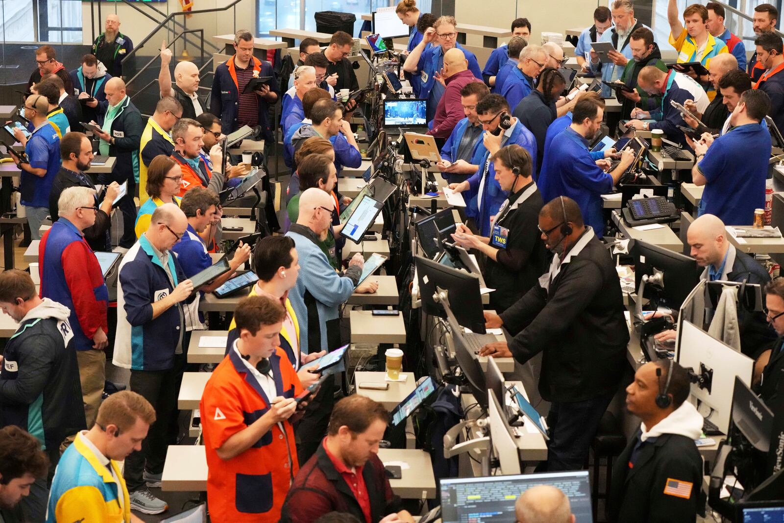 Traders work on the options trading floor at the Cboe Global Markets in Chicago, Tuesday, April 8, 2025. (AP Photo/Nam Y. Huh)