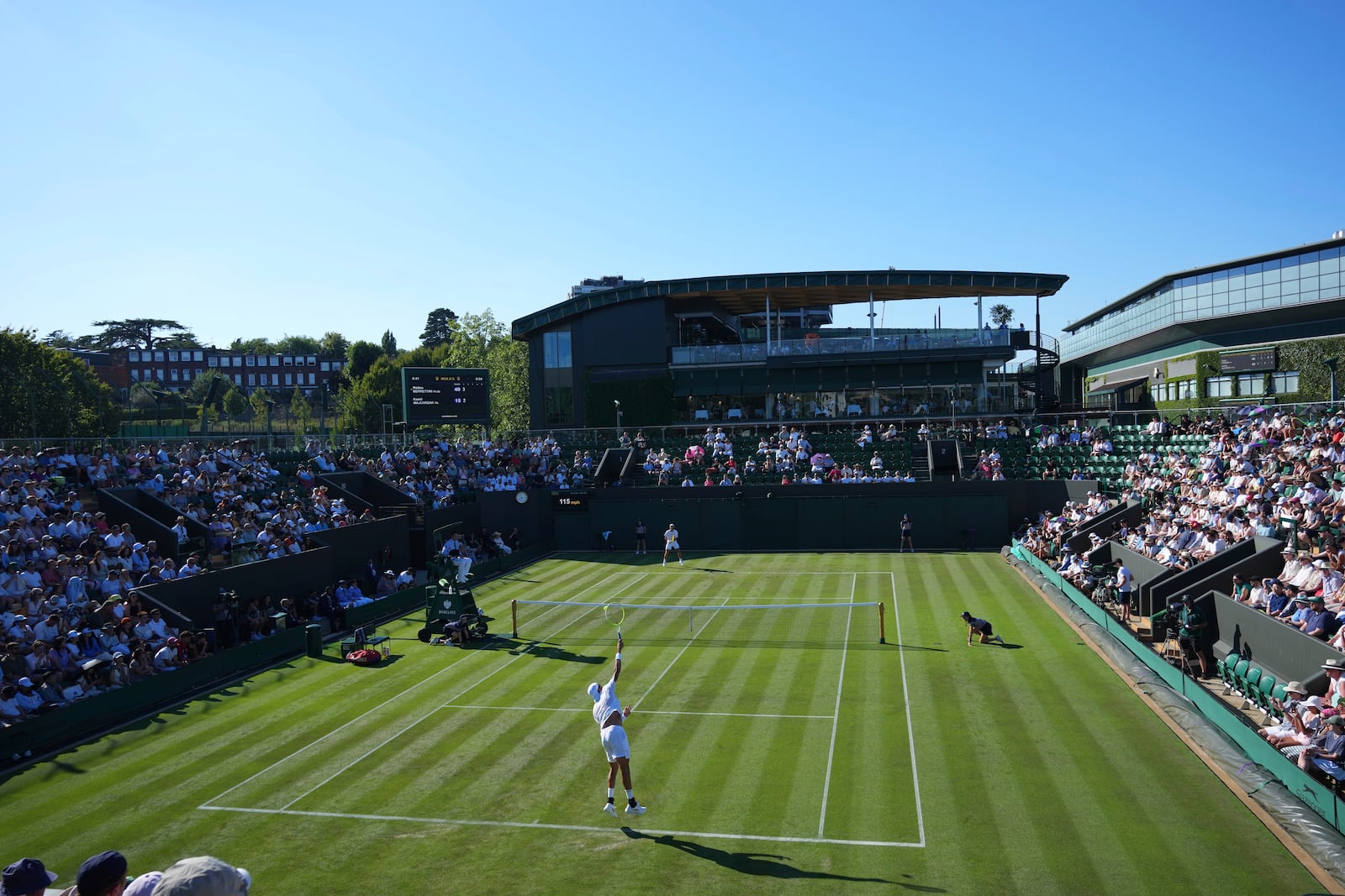Matteo Berrettini of Italy serves to Kamil Majchrzak of Poland in their first round men's singles match at the Wimbledon Tennis Championships in London, Monday, June 30, 2025. (AP Photo/Joanna Chan)