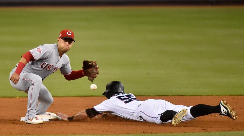 MIAMI, FL - AUGUST 26: Jon Berti #55 of the Miami Marlins steals second base during the third inning against the Cincinnati Reds at Marlins Park on August 26, 2019 in Miami, Florida. (Photo by Eric Espada/Getty Images)