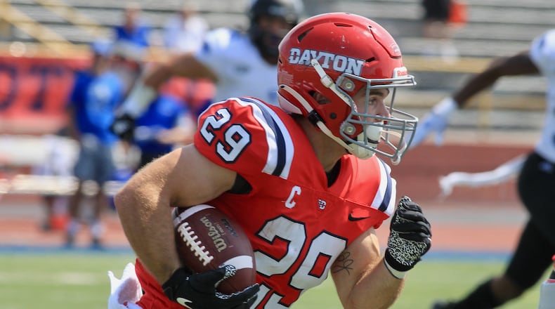 Dayton's Jake Chisholm runs against Eastern Illinois on Saturday, Sept. 11, 2021, at Welcome Stadium. David Jablonski/Staff