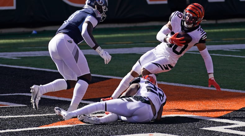 Cincinnati Bengals' Jessie Bates (30) intercepts a pass intended by Tennessee Titans' A.J. Brown during the first half of an NFL football game, Sunday, Nov. 1, 2020, in Cincinnati. (AP Photo/Bryan Woolston)