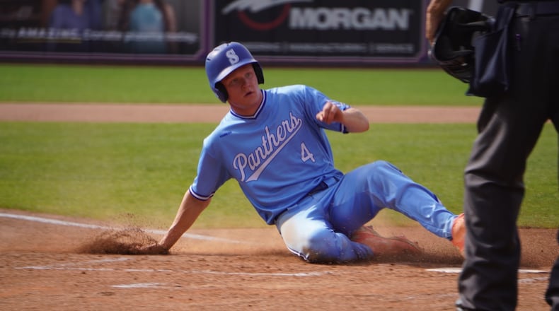 Springboro's Vince Fortkamp slides across the plate during his Division I state championship game against Lewis Center Olentangy on Sunday at Canal Park in Akron. CHRIS VOGT / CONTRIBUTED