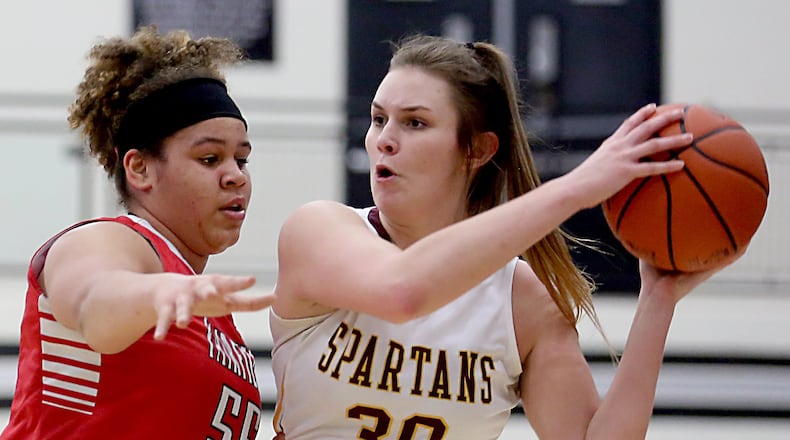 Fairfield forward Maddie Schaeffer pressures Turpin center Charlotte Kerregan during their Division I sectional game at Lakota East on Feb. 23, 2017. COX MEDIA FILE PHOTO