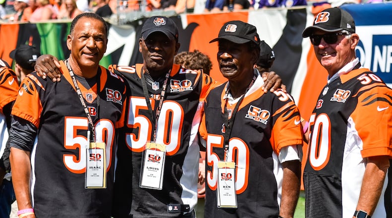 Former Bengals players (L to R) Isaac Curtis, Louis Breeden, Ken Riley and Ken Anderson gather before they are recognized at halftime. The Cincinnati Bengals lost 20-0 to the Baltimore Ravens Sunday, Sept. 10 at Paul Brown Stadium in Cincinnati. NICK GRAHAM/STAFF