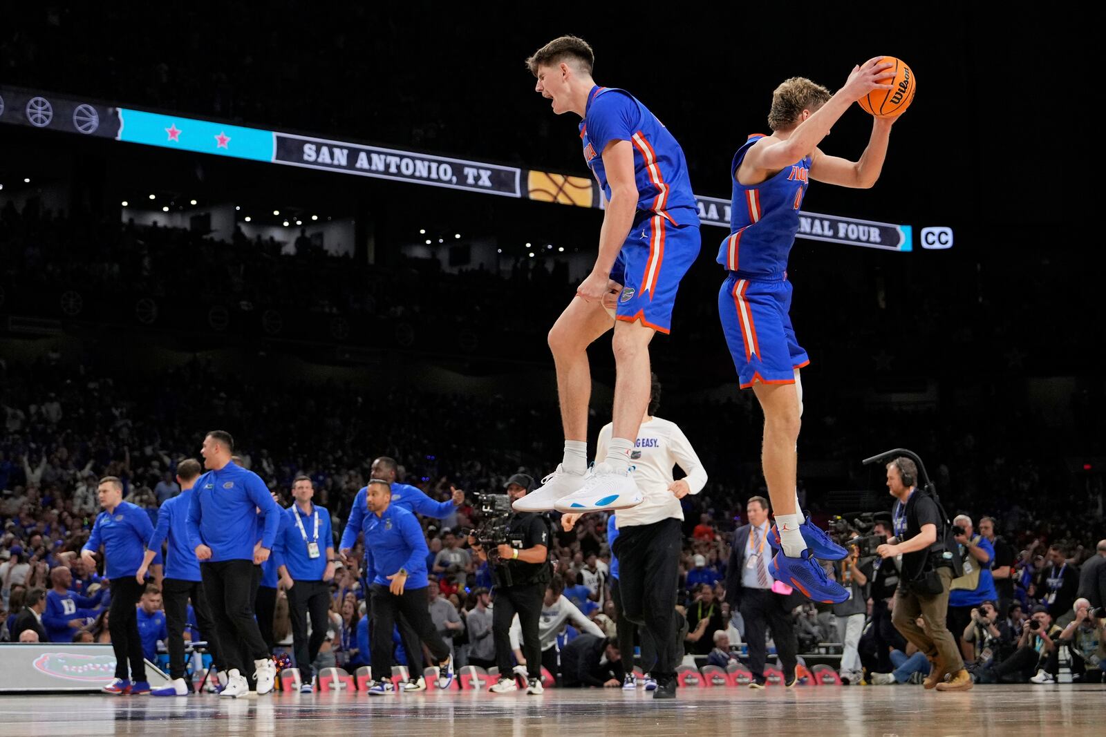 Florida forward Alex Condon and forward Thomas Haugh celebrate their win against Auburn in the national semifinals at the Final Four of the NCAA college basketball tournament, Saturday, April 5, 2025, in San Antonio. (AP Photo/Brynn Anderson)