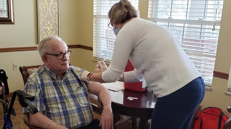 Resident Ron Colombe of Miller Farm Place senior living receives a COVID-19 vaccine dose. CONTRIBUTED