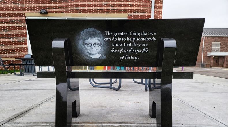 A bench in memory of James Hutchinson has been placed outside at Rosa Parks Elementary School in Middletown. NICK GRAHAM / STAFF
