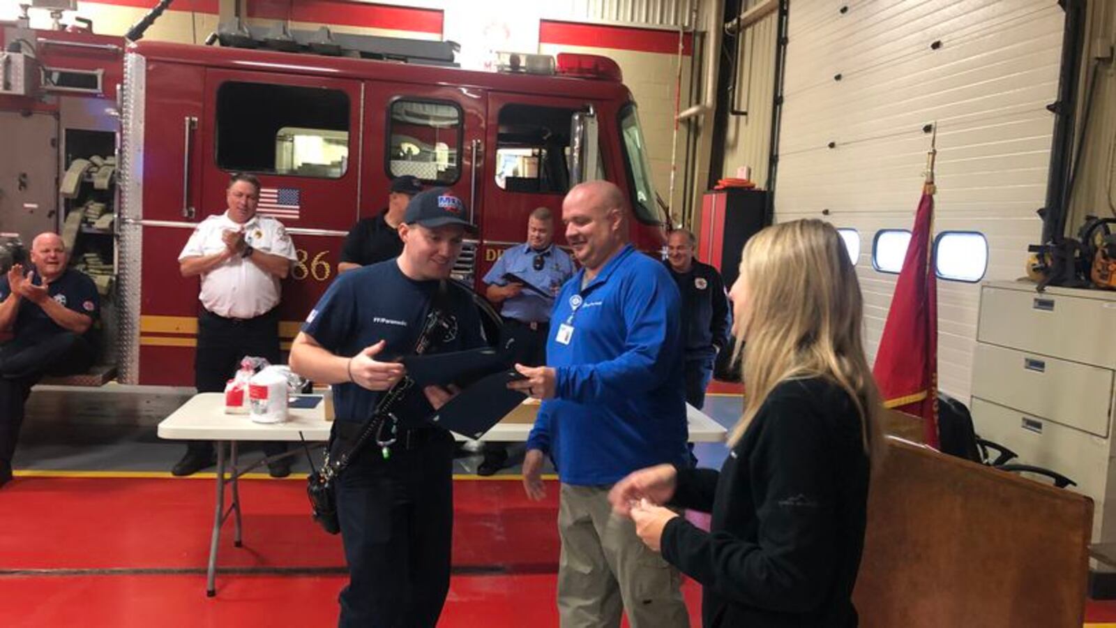 Middletown firefighter Ethan Clark, 26, who has worked in Middletown for five years, helped deliver a baby on Sept. 16. Clark and nine other firefighters received certificates and stork pins Wednesday from Rich Morrett, emergency medical services director at Atrium Medical Center, and Dr. Jill Aston, director of Atrium Medical Center’s Level III Emergency Trauma Center and medical director for the Middletown and Monroe fire and EMS departments. RICK McCRABB/STAFF