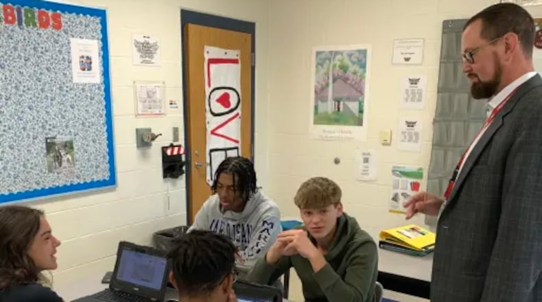 Nothing beats eye witnessing learning for understanding how classroom instruction is going and Lakota Schools have revived a pre-COVID 19 program to give more school and district leaders more opportunities. These weekly “learning walks” are vital to solidifying the bridges between classroom teachers and school building and Lakota central office administrators, said district officials. Pictured is Lakota West High School Principal Ben Brown chatting with students during a recent learning walk. (Provided Photo\Journal-News)