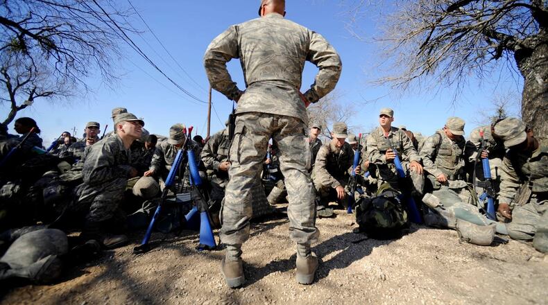 Master Sgt. Tim Burton, Military Training Instructor, 737 Training Support Squadron, prepares his basic trainees for gas mask training at the Basic Expeditionary Airman Skills Training program in Medina Air Base, San Antonio, Texas, in this 2009 Air Force photo.