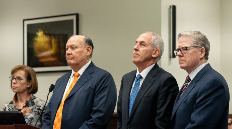 Former FirstEnergy executives Chuck Jones and Michael Dowling stand with their attorneys Carole Rendon, on left, and John McCaffrey, on right, to waive their right to testify before Judge Susan Baker Ross in Akron on March 12, 2026. LISA SCALFARO/AKRON BEACON JOURNAL PHOTOGRAPHER
