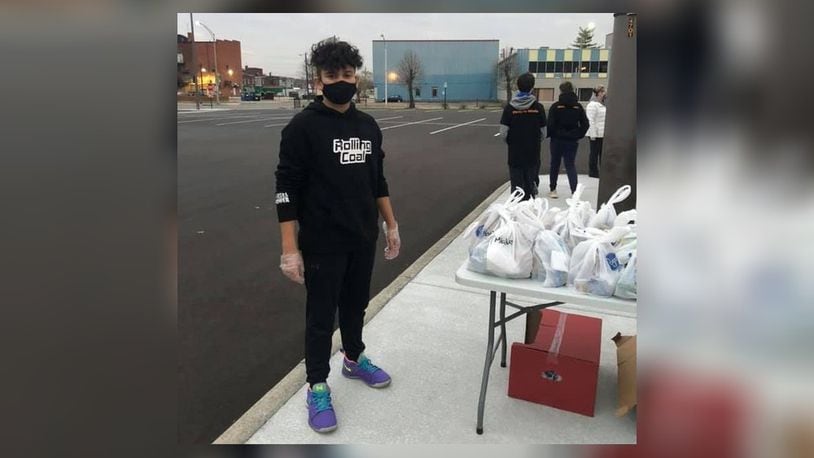 Ashtyn Bennett, of Middletown, took the $150 his parents gave him for his 14th birthday and used the money to buy food for the homeless. Ashtyn and his friends served 78 homeless meals Friday in downtown Middletown. SUBMITTED PHOTO
