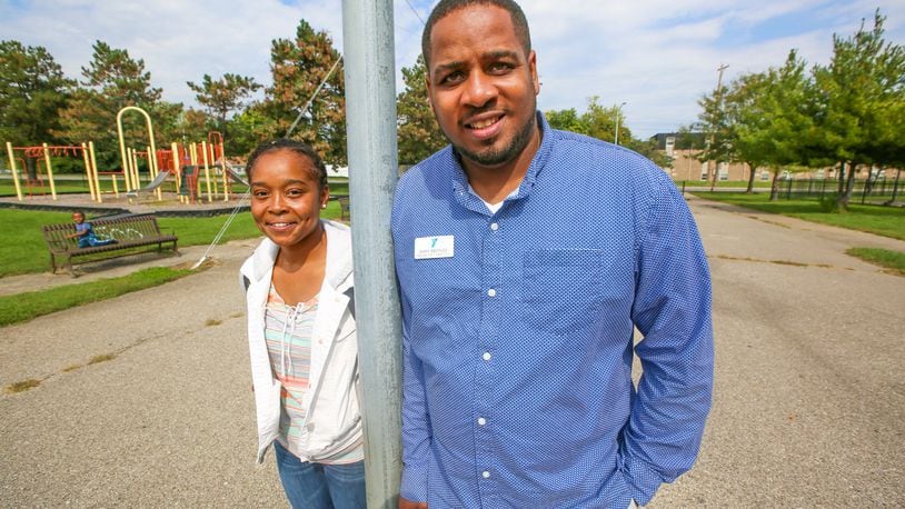 Tif Johnson and Samy Broyles received a 17 Strong micro-grant in 2016 to remake a basketball court at a Hamilton park. Grant applications are now being accepted for the 2017 program. STAFF FILE/2016