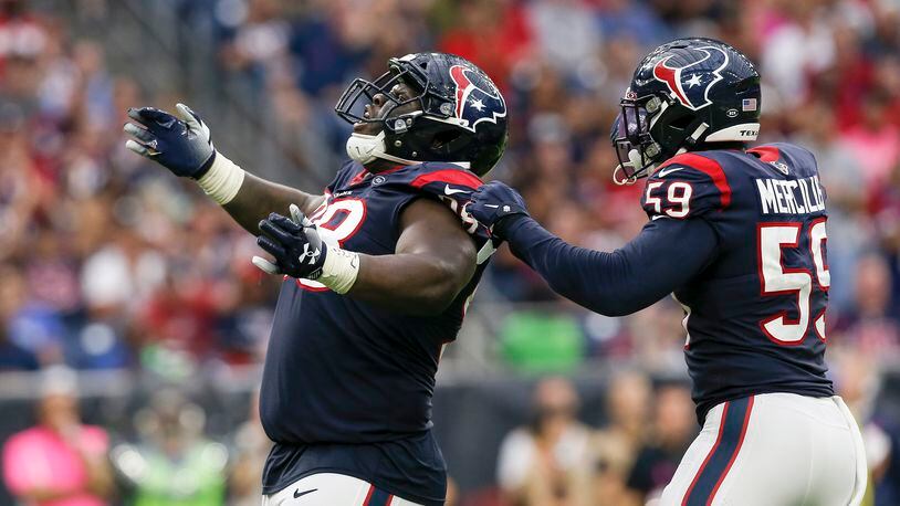 HOUSTON, TX - OCTOBER 06: D.J. Reader #98 of the Houston Texans celebrates with Whitney Mercilus #59 after a sack in the second half against the Atlanta Falcons at NRG Stadium on October 6, 2019 in Houston, Texas. (Photo by Tim Warner/Getty Images)