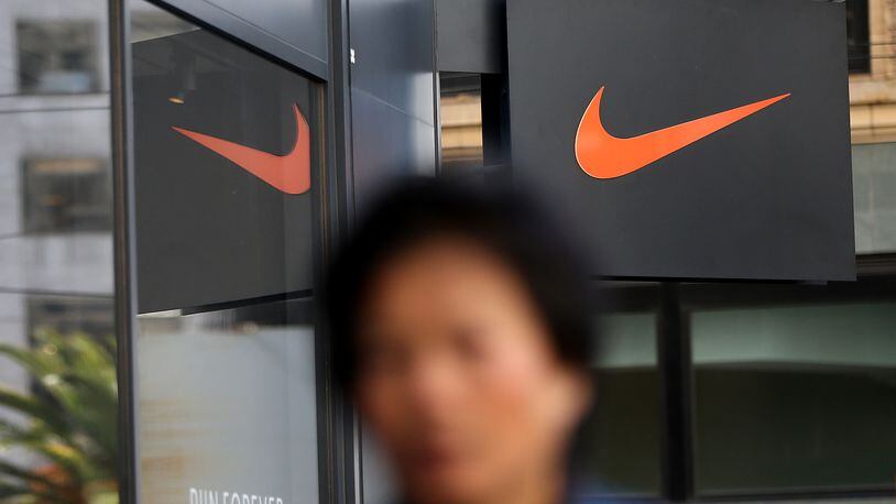SAN FRANCISCO, CA - MARCH 22: A pedestrian walks by a Nike store on March 22, 2016 in San Francisco, California. Nike Inc. will announce third-quarter earnings after the closing bell. (Photo by Justin Sullivan/Getty Images)