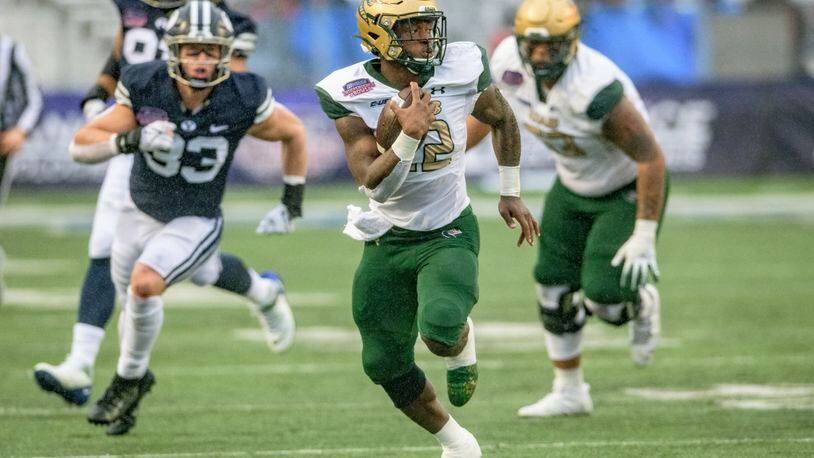 UAB running back DeWayne McBride (22) breaks free for a touchdown run during the first half of the Independence Bowl NCAA college football game against BYU in Shreveport, La., Saturday, Dec. 18, 2021. (AP Photo/Matthew Hinton)