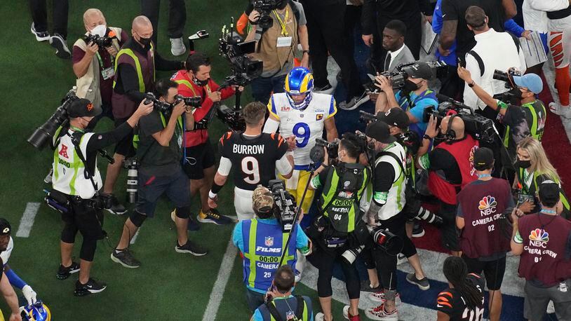 Cincinnati Bengals quarterback Joe Burrow (9) and Los Angeles Rams quarterback Matthew Stafford (9) shake hands at the end of the NFL Super Bowl 56 football game, Sunday, Feb. 13, 2022, in Inglewood, Calif. (AP Photo/Morry Gash)
