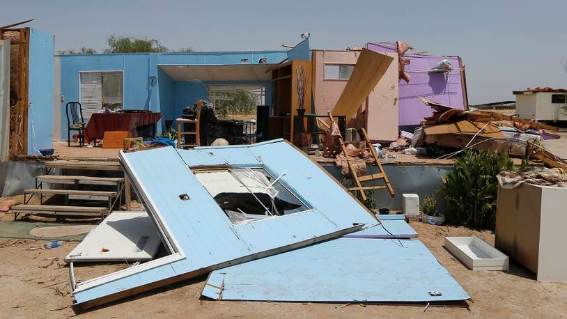 A mobile home was destroyed by a monsoon storm as this residence and other properties were severely damaged Monday, July 9, 2018, in Buckeye, Arizona.