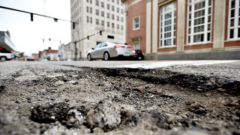 Middletown voters will have the opportunity to approve a 10-year,  0.25% increase to the city income tax that would generate about $3 million for street improvements and resurfacing. FILE PHOTO



Trenton City Council plans to go for a street levy in November, not just because of the craters the rough weather has opened up this winter, but generally deteriorating roadways. Pictured here is a pot hole opened up in Middletown that illustrates how bad the roads are countywide.