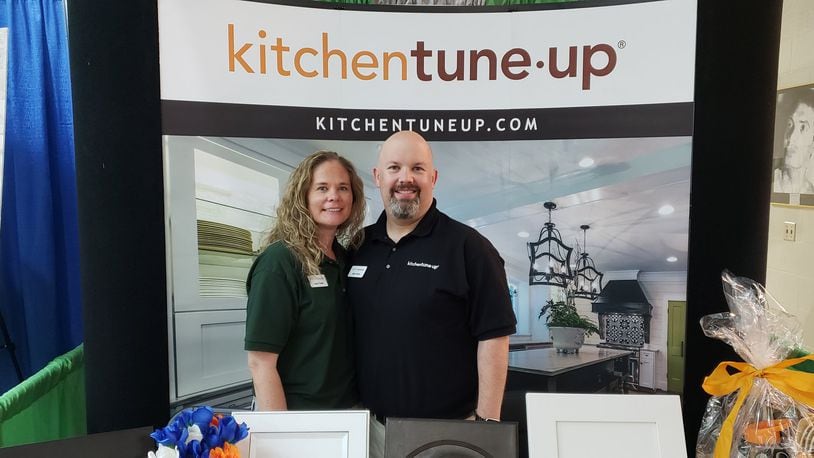 Laura and Matt Fields, of Liberty Twp., stand at the booth for their new Kitchen Tune-Up franchise at the West Chester/Liberty Chamber Alliance’s Regional Business Expo at Lakota West High School July 30, 2019. ERIC SCHWARTZBERG/STAFF