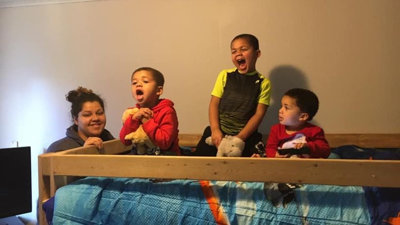 Kayla Richardson, 29, of Middletown, called receiving two beds from Sleep in Heavenly Peace ‘a blessing.’ Her three sons, from left, Jayden, Trevion and Amarion received beds Saturday. SUBMITTED